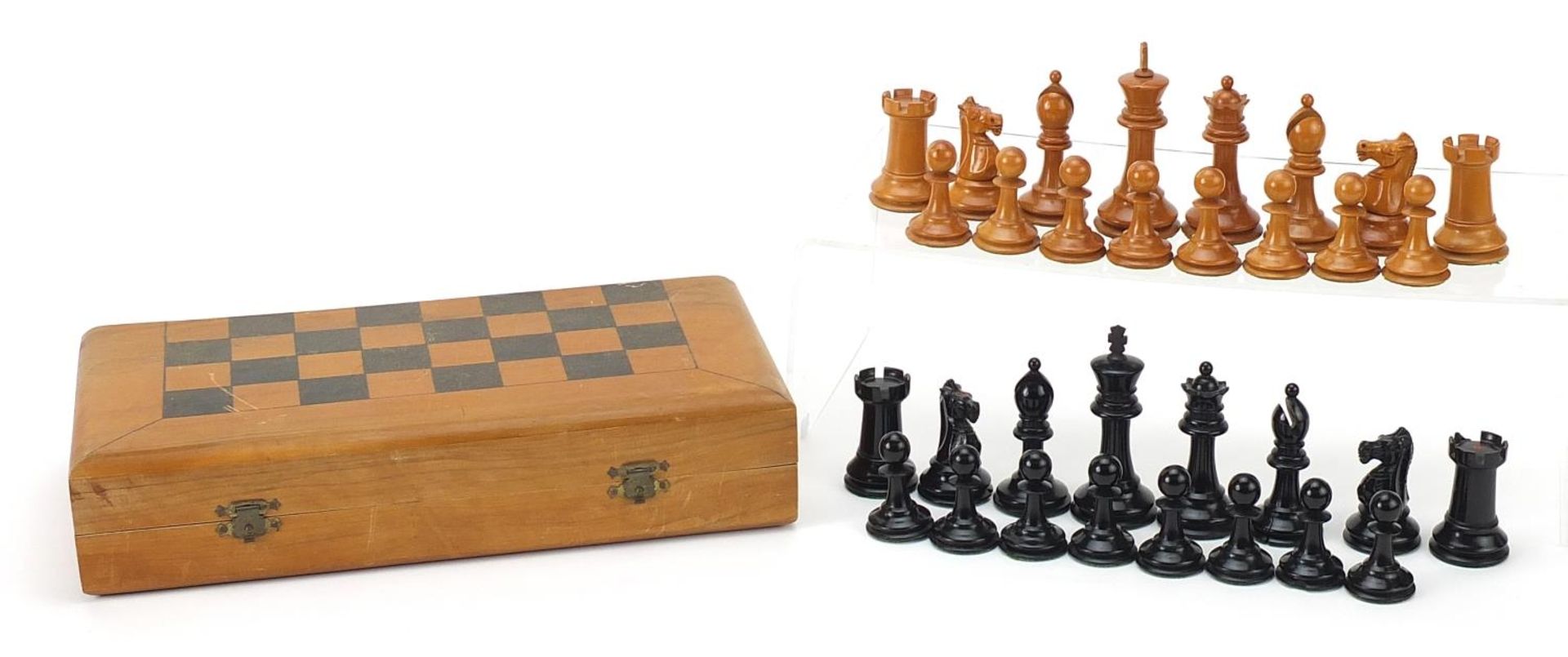 Ebony and boxwood Staunton pattern chess set with folding board, the largest pieces each 8cm high