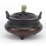 Chinese patinated bronze tripod censer with hardwood lid and carved jade knop, four figure character