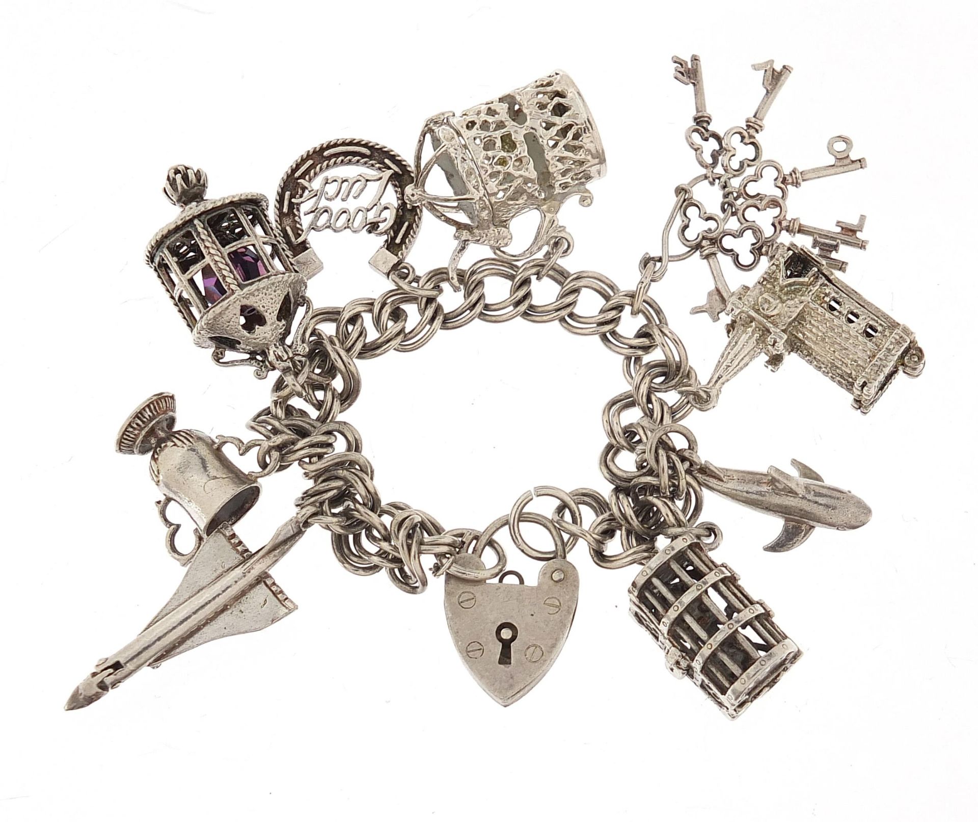 Silver charm bracelet with a selection of mostly silver charms including Concorde, 16cm in length,