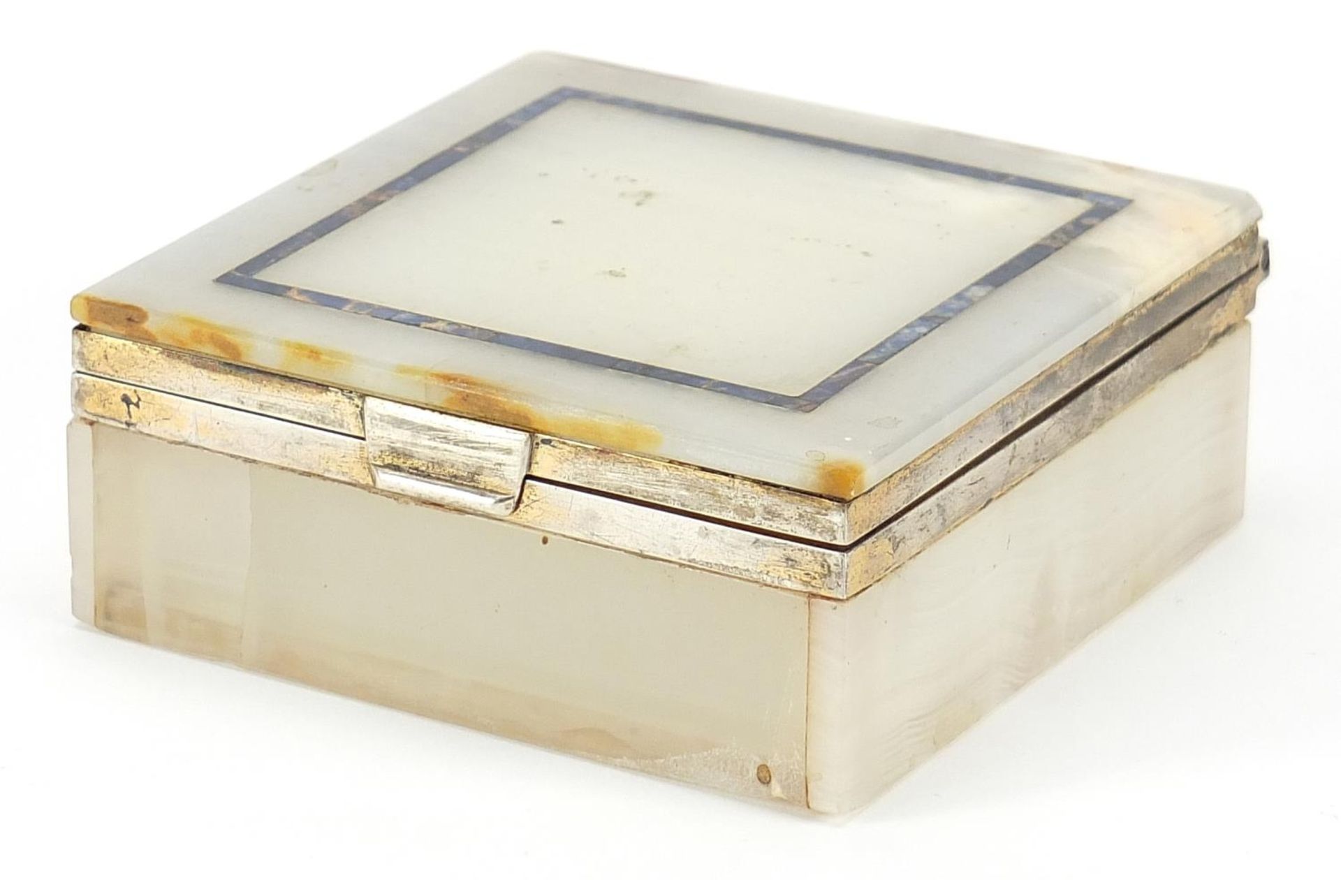 Silver mounted onyx and lapis lazuli cigarette box, 4.5cm H x 9.5cm W x 10cm D One of the front