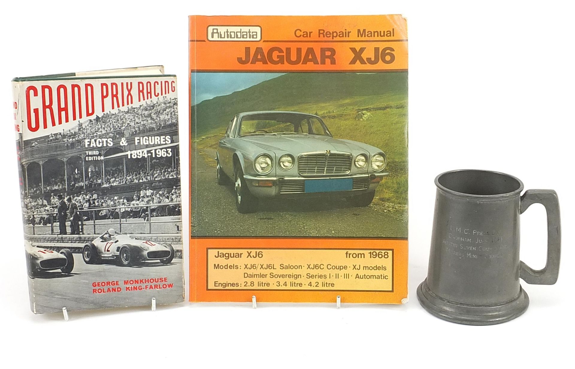 Two motor racing interest books and a pewter tankard engraved BMC Press Day, Cobham July 1961,