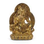 Chino Tibetan gilt bronze figure of a deity on mythical animal, 25cm high Overall in generally