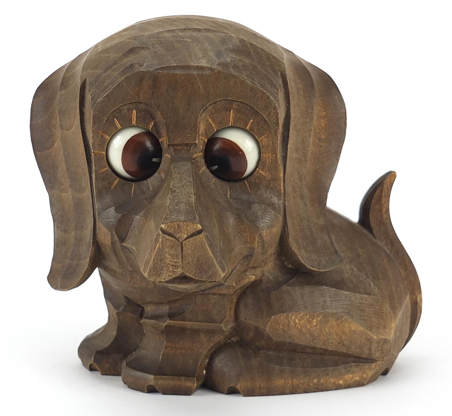 Novelty carved Black Forest clock with moving eyes in the form of a dog, 11.5cm wide