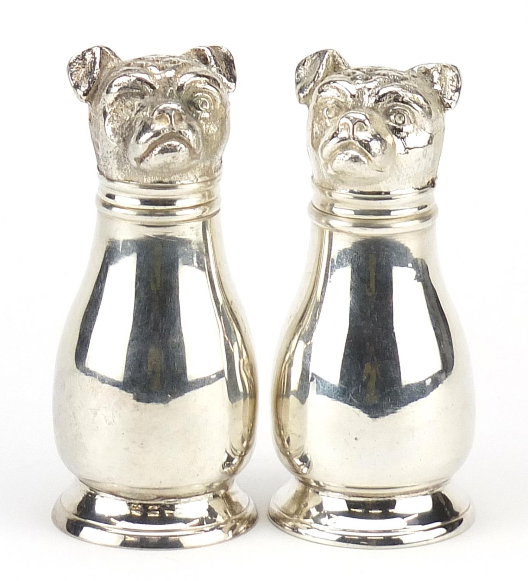 Pair of novelty silver plated casters in the form of French Bulldogs, 10.5cm high Appears to be in