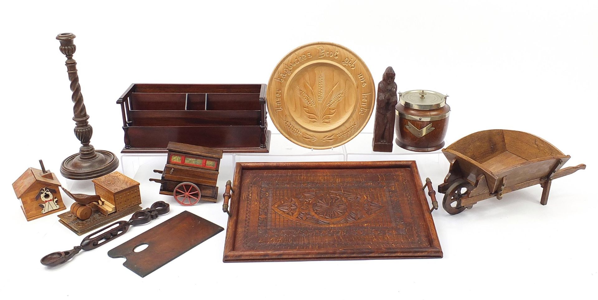 Woodenware including an antique oak wood carving of a priest, mahogany desk letter rack,
