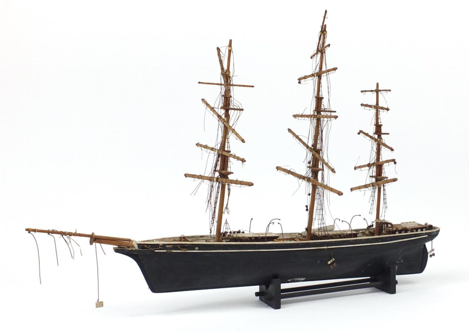 Hand painted wooden model of a rigged sailing ship, 73cm in length