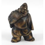 Japanese patinated bronze sculpture of a warrior holding a fan, 19.5cm high Overall in generally