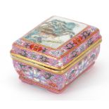 Chinese porcelain rouge pink ground seal box hand painted in the famille rose palette with a