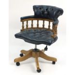 Lightwood framed Captain's chair with blue leather button back upholstery, 90cm high