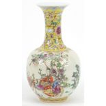 Chinese porcelain vase finely hand painted in the famille rose palette with figures and animals in a