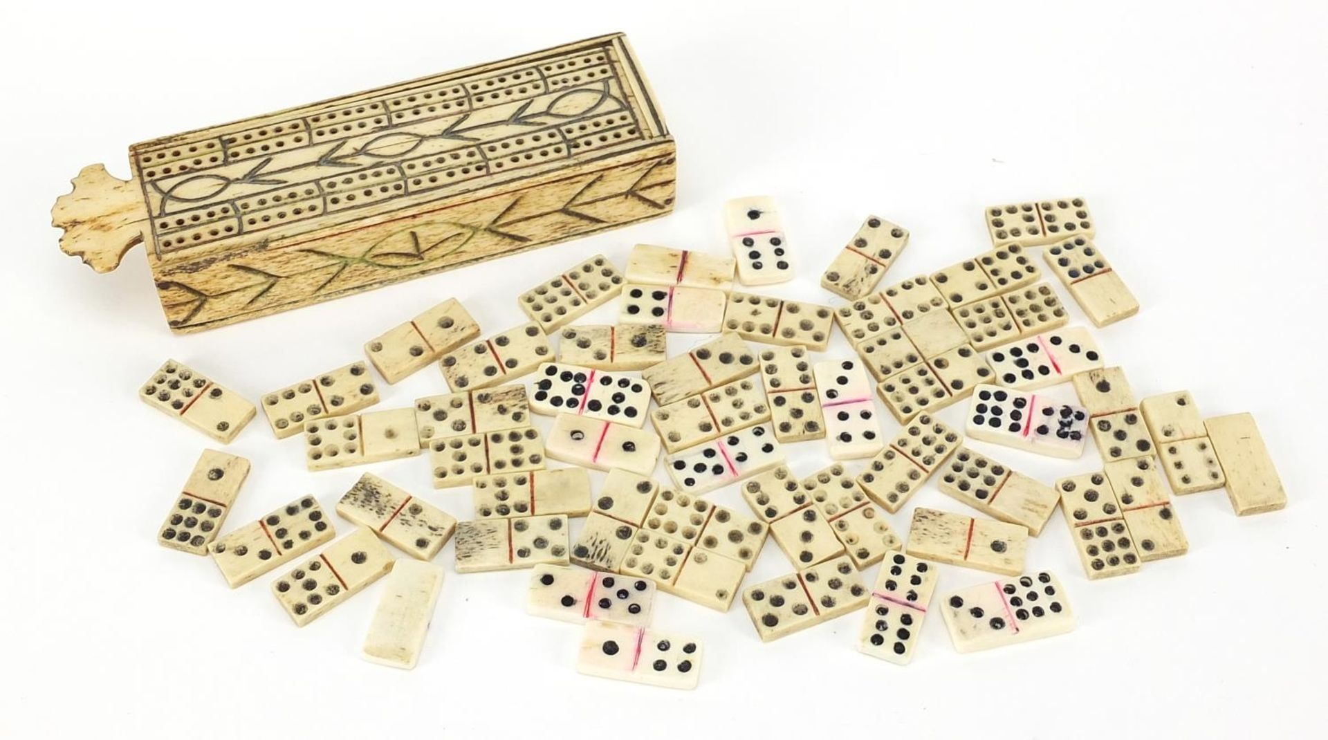 Antique prisoner of war bone dominoes housed in a cribbage board with slide lid, 13cm wide There are