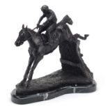 Large patinated bronze jockey on horseback raised on a shaped marble base, 33cm high Overall in