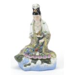 Chinese porcelain figure of Guanyin riding a tortoise hand painted with flowers, 29cm high One of