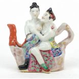 Chinese porcelain erotic figural teapot hand painted in the famille rose palette, impressed