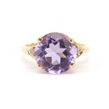 9ct gold amethyst solitaire ring set with white sapphires to the shoulders, the amethyst 12mm in