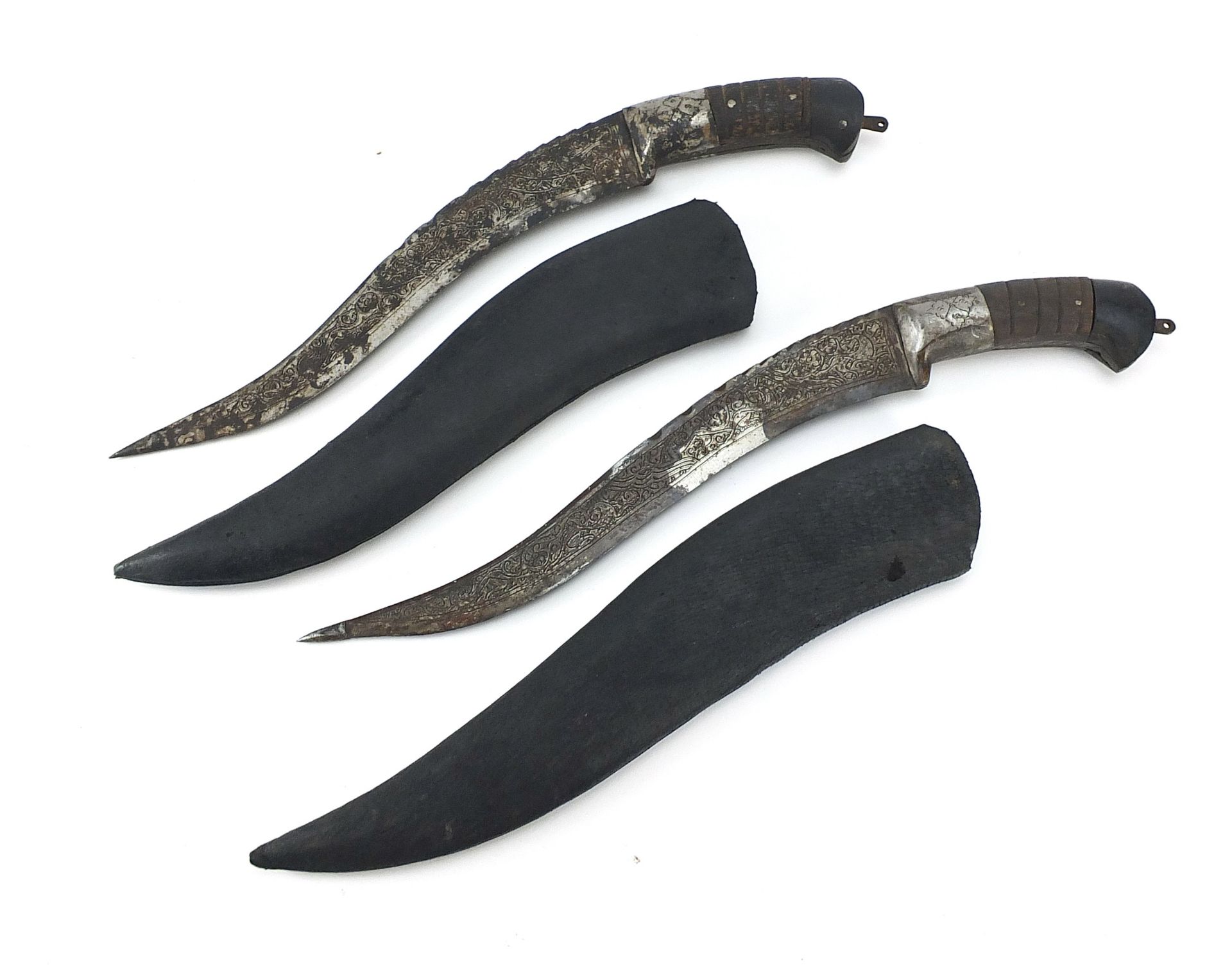 Two Afghan pesh-kabz knives with sheaths and engraved steel blades, 40cm and 38cm in length