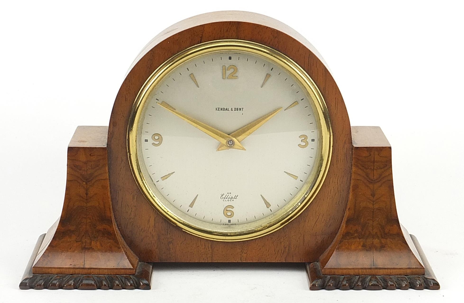 Kendal & Dent, walnut Eliott mantle clock with circular dial having Arabic numerals, impressed Y2917