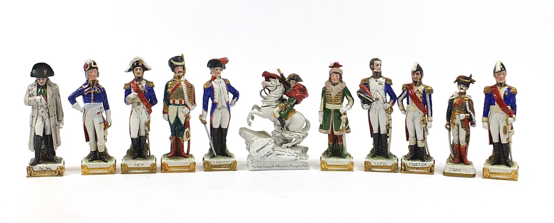 Military interest continental porcelain figures including Napoleon Bonaparte on horseback and