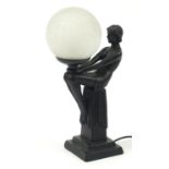 Art Deco design table lamp in the form of a nude female with globular glass shade, 43.5cm high