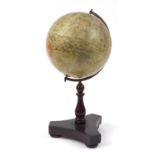 Geographia 10 inch terrestrial table globe raised on a hardwood base with turned column and brass