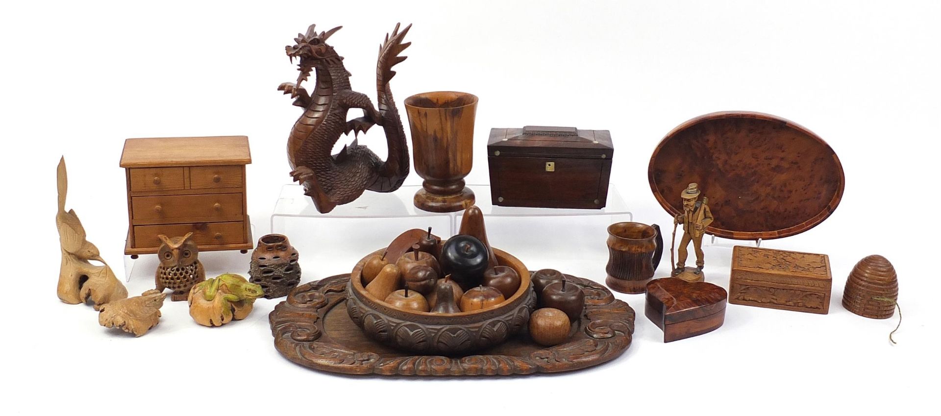Woodenware including a Victorian rosewood tea caddy with twin divisional interior, carved fruit,