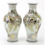 Pair of Chinese porcelain baluster vases hand painted with birds amongst trees, character marks to