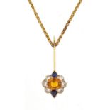 Unmarked gold orange stone, diamond and sapphire pendant on an 18ct gold necklace, the orange