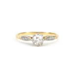 Unmarked gold and platinum diamond solitaire ring with diamond set shoulders, approximately 0.8ct,