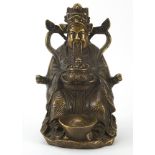 Chinese patinated bronze figure of a seated Emperor, 20cm high
