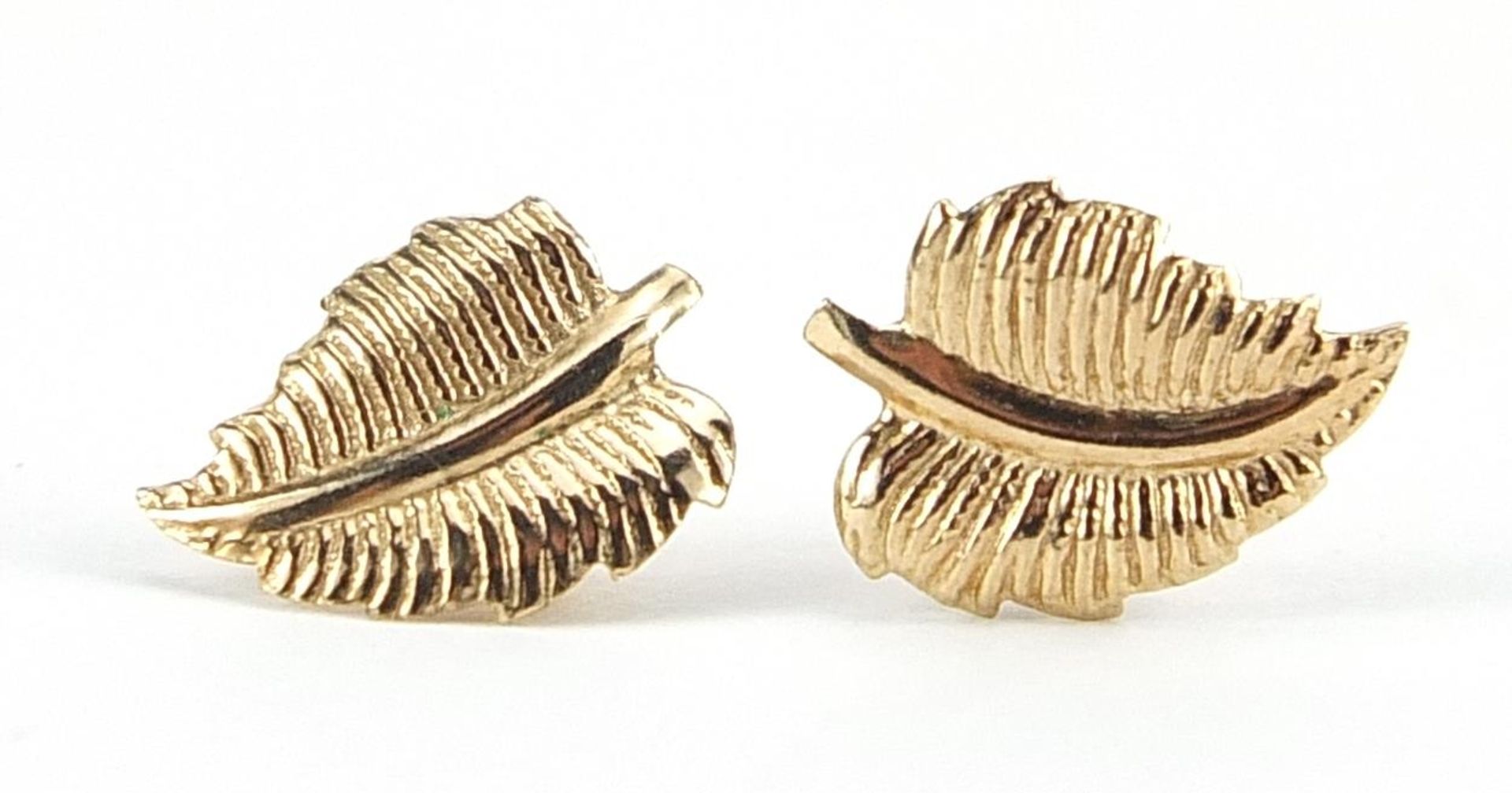 Pair of 9ct gold leaf stud earrings, 1cm high, 0.3g