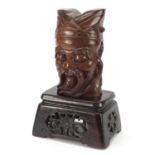Chinese carved wood bust of an Emperor raised on a hardwood stand carved and pierced with flowers,