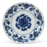 Chinese blue and white porcelain dish hand painted with flower heads amongst scrolling foliage,