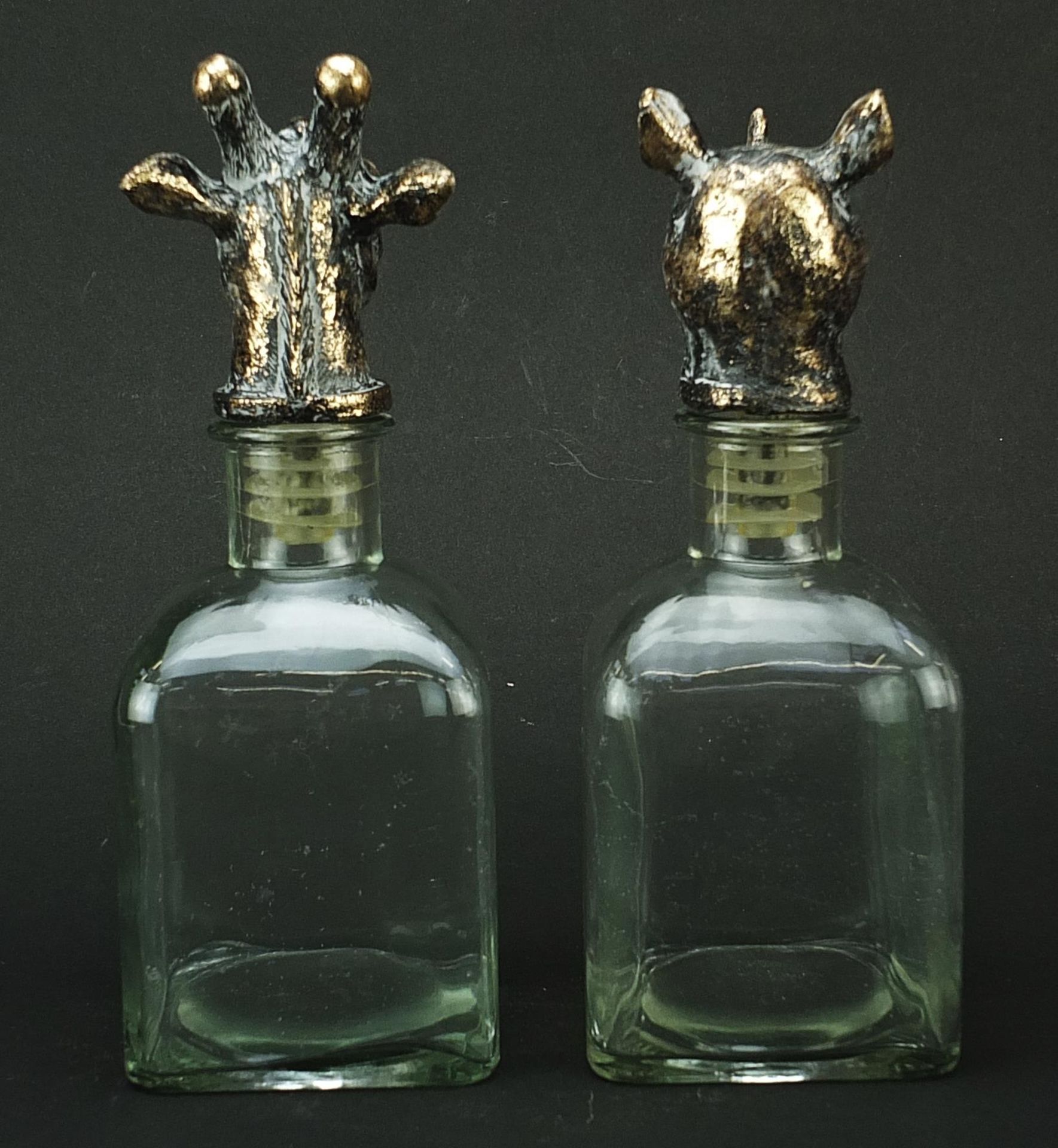 Pair of glass decanters with bronzed rhinoceros and giraffe head stoppers, 24cm high Both appear - Image 2 of 3
