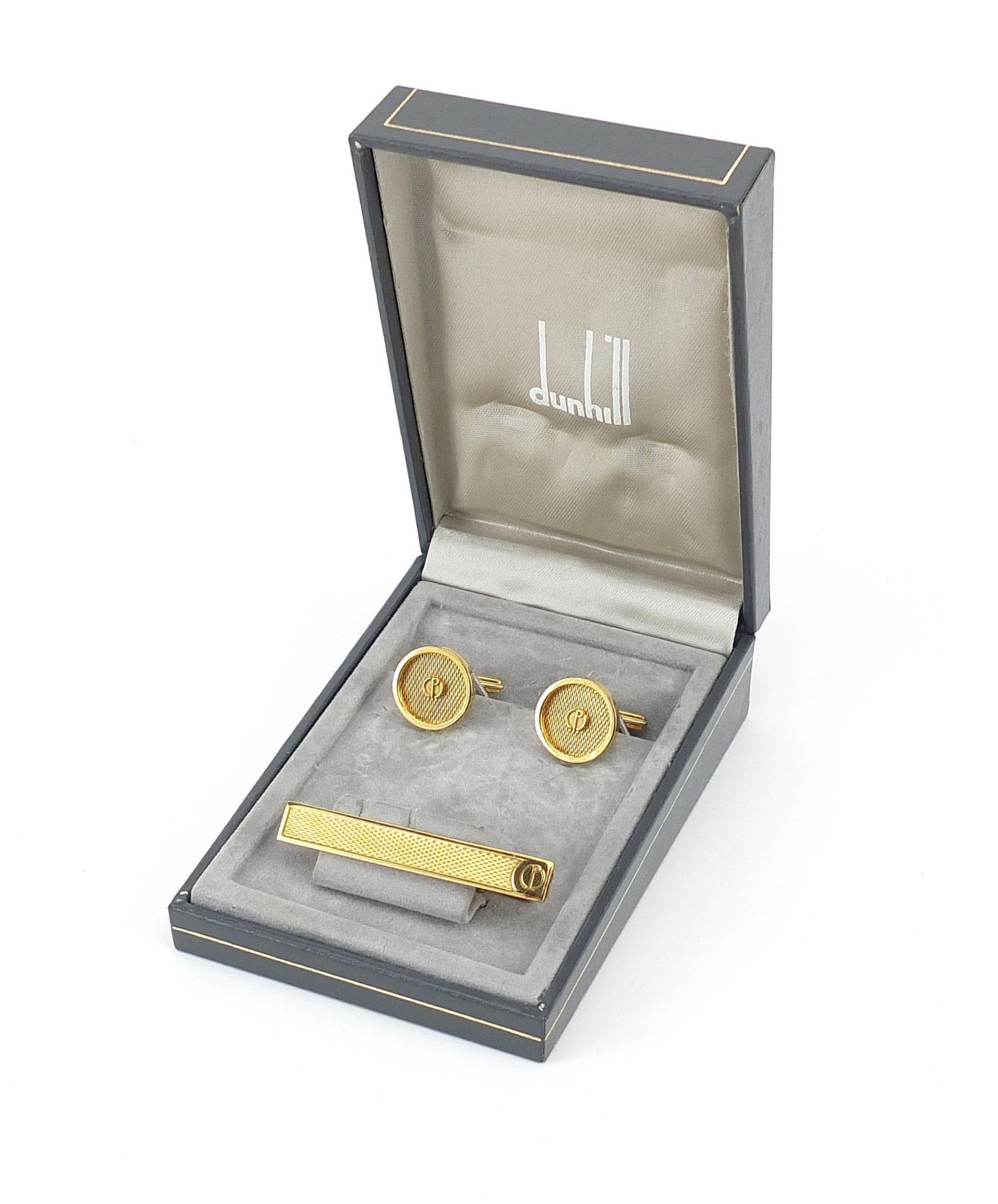 Dunhill, pair of gold plated cufflinks and tie clip with fitted box, the tie clip 5.2cm in length