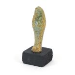 Egyptian style ushabti raised on a wooden base, overall 8.5cm high