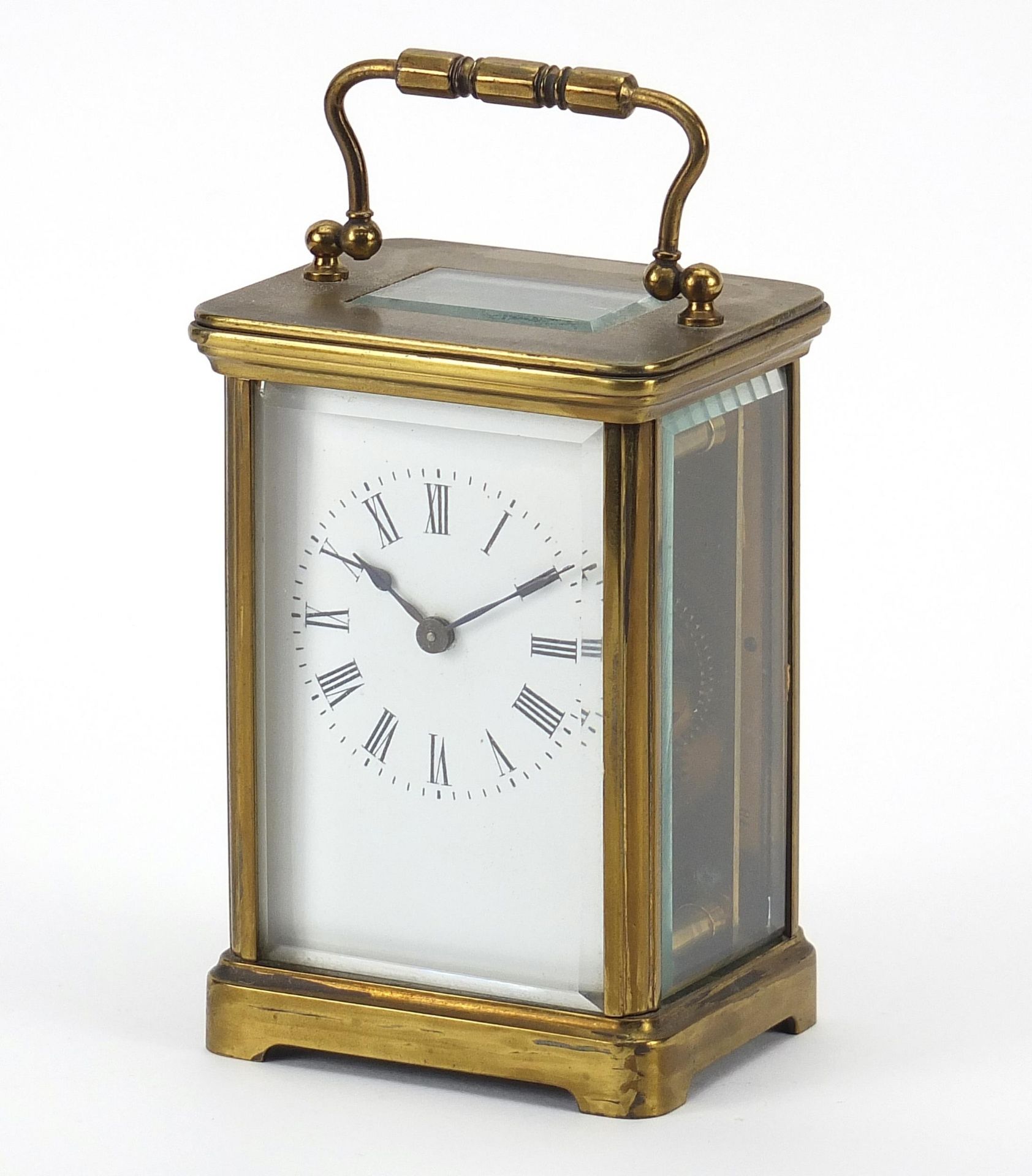 Brass cased carriage clock with enamelled dial and Roman numerals, 11cm high