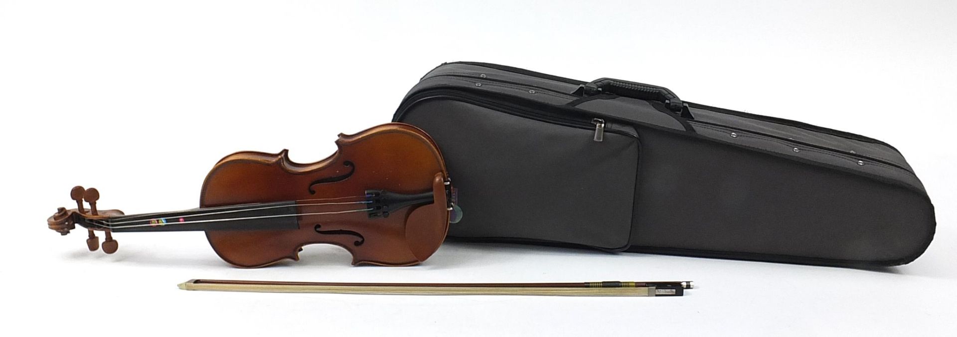 Child's violin with bow and case with Sandner paper label, the back 32cm in length