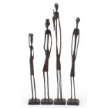 Four Modernist patinated bronze studies of African tribes people, the largest 51cm high