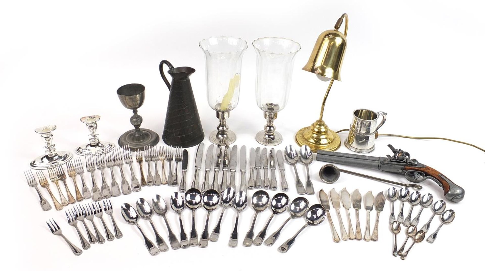 Metalware including silver plated cutlery, copper flagon, brass desk lamp and a decorative flintlock