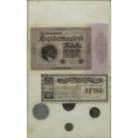 Framed display of German banknotes and tokens including a Maidstone Corporation Tramways workman's