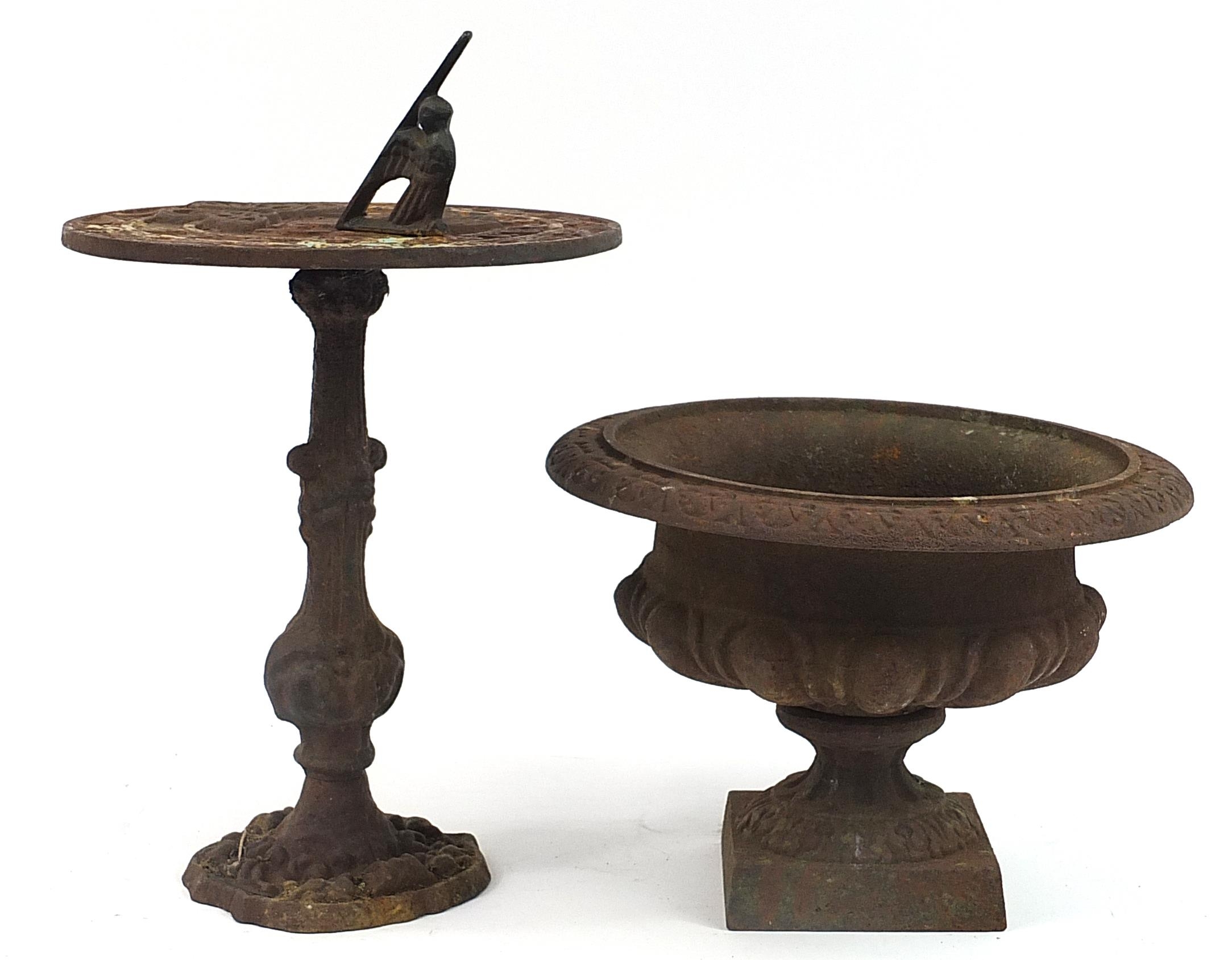 Cast iron sundial and urn planter, the largest 43cm high