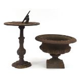 Cast iron sundial and urn planter, the largest 43cm high