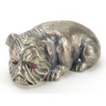 Silver recumbent Bulldog with ruby eyes, impressed Russian marks to the base, 6.5cm in length, 60.2g