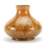 William Moorcroft pottery vase having a mottled orange glaze, 15.5cm high