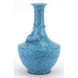 Chinese porcelain vase having a blue glaze decorated in relief with a water dragon, impressed six