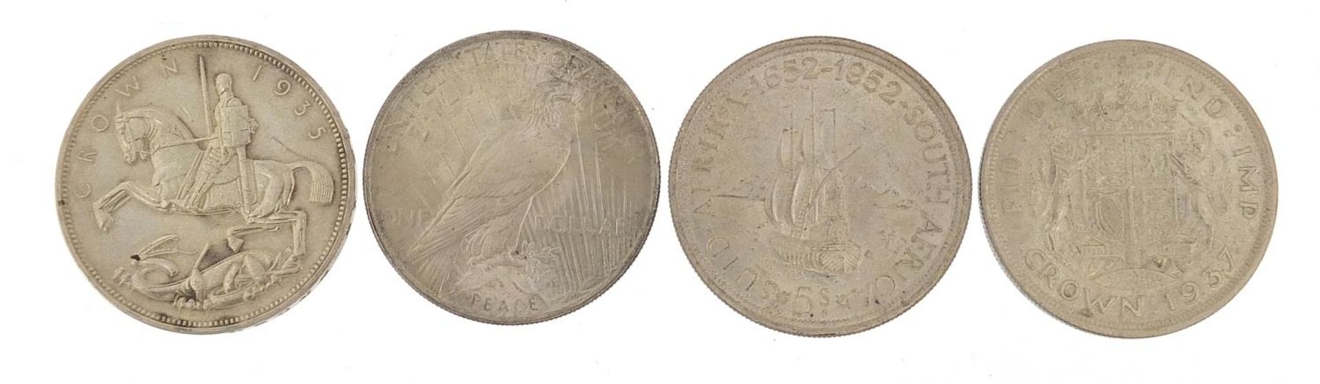 Two 1935 Rocking Horse crowns, 1922 dollar and 1952 South African example