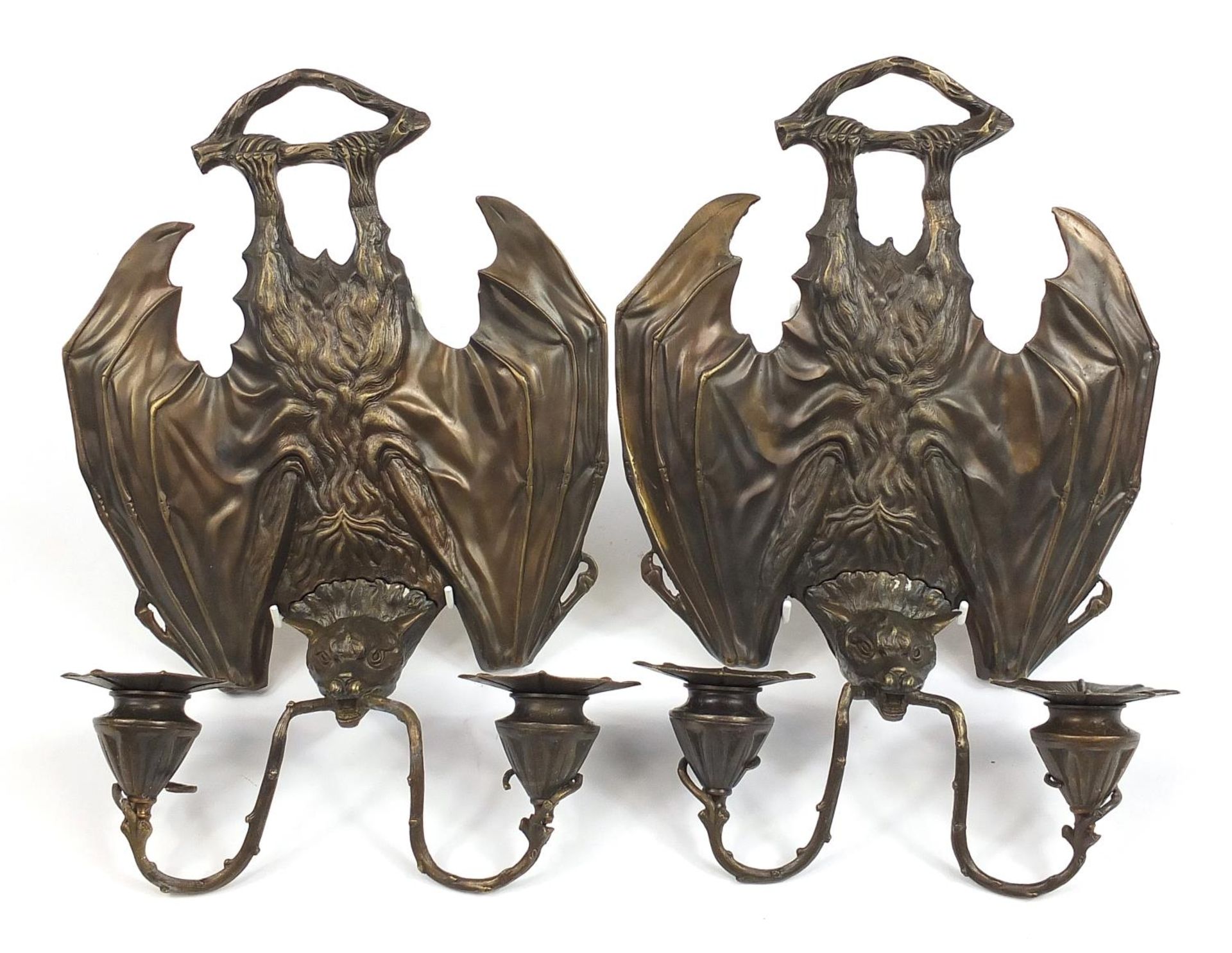 Pair of Art Nouveau style bat design patinated bronze wall sconces, each 35cm high