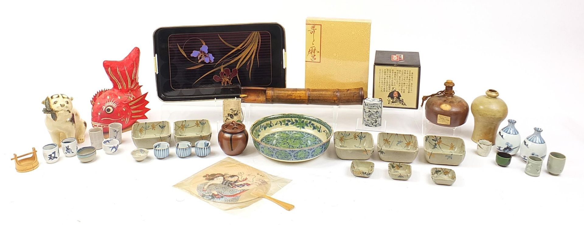 Japanese ceramics, pottery and objects including a lacquered tray, seated dog, fan and tea bowls,