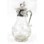 Large silver plated claret jug with glass body etched with leaves and berries, 31.5cm high