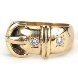 9ct gold diamond two stone buckle ring, size L, 5.9g